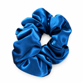 Blue satin scrunchie on a white background